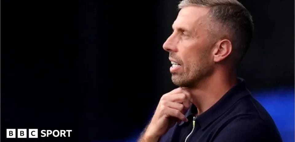 Coach observing during a match or training session