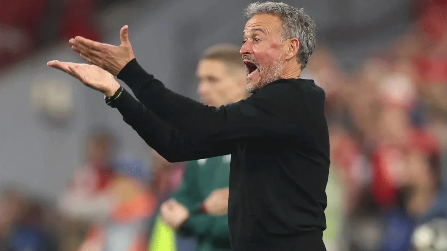 Coach gesturing during a football match