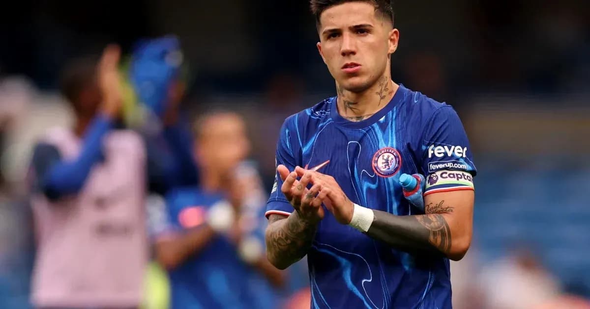 Player in Chelsea jersey clapping after match