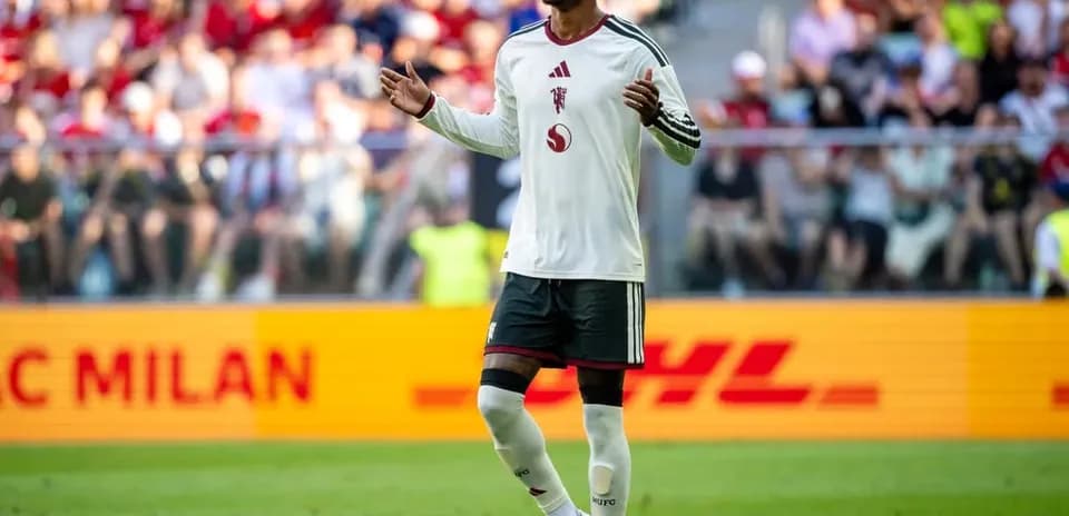 Player gesturing during match in front of crowd
