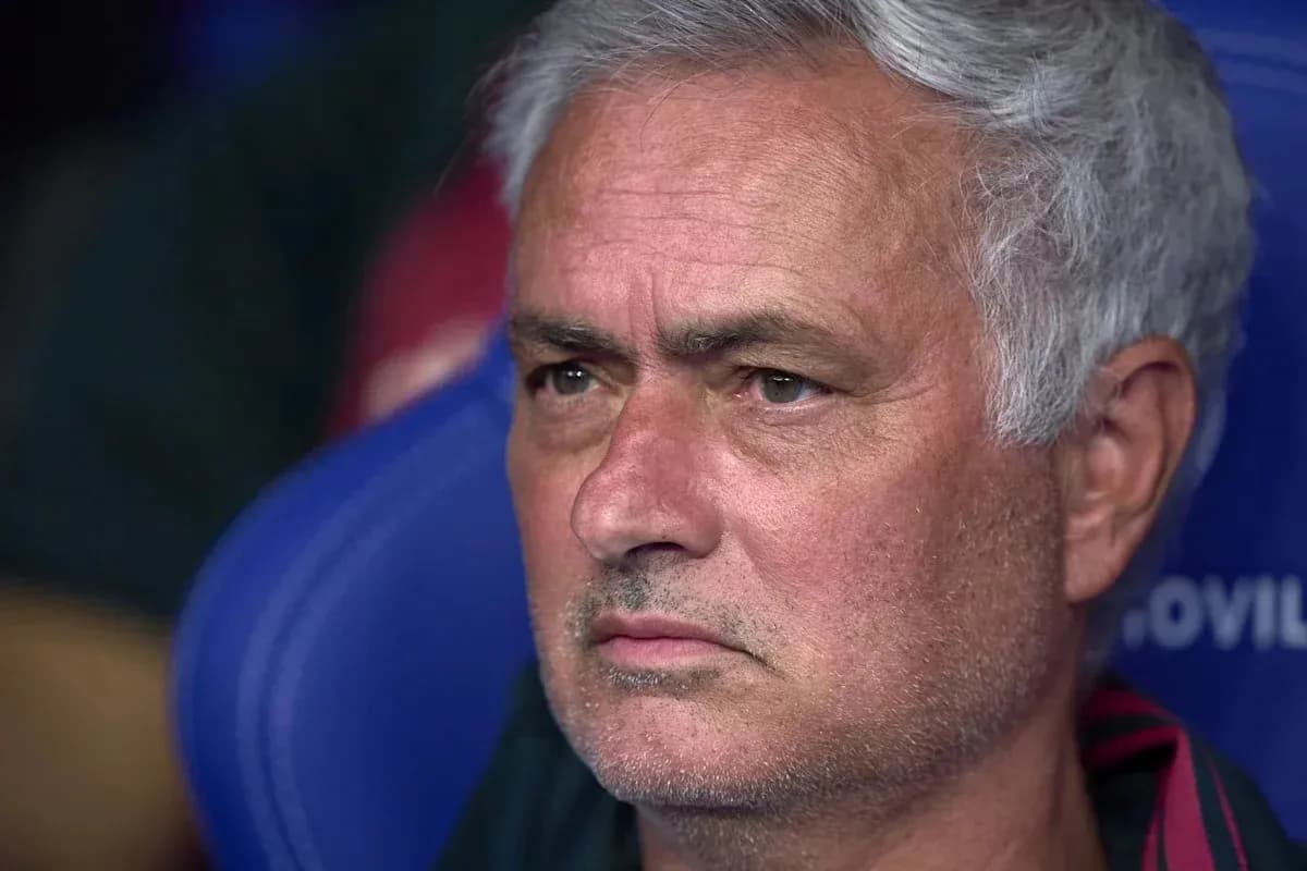 Manager sitting on the bench during match