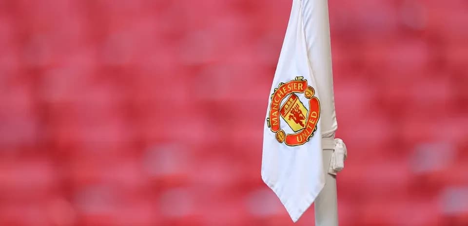 Corner flag with Manchester United logo at stadium