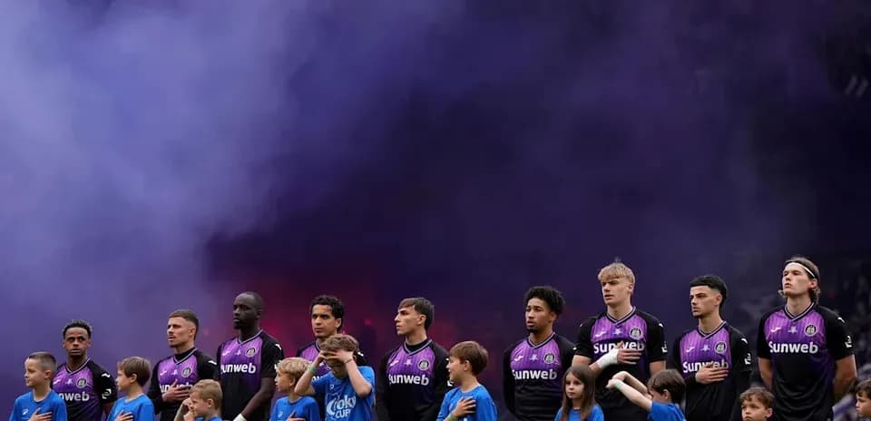 Players and children standing for national anthem