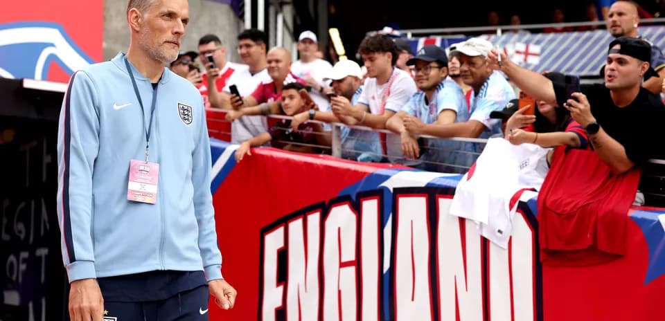 Coach walking towards fans before match in stadium