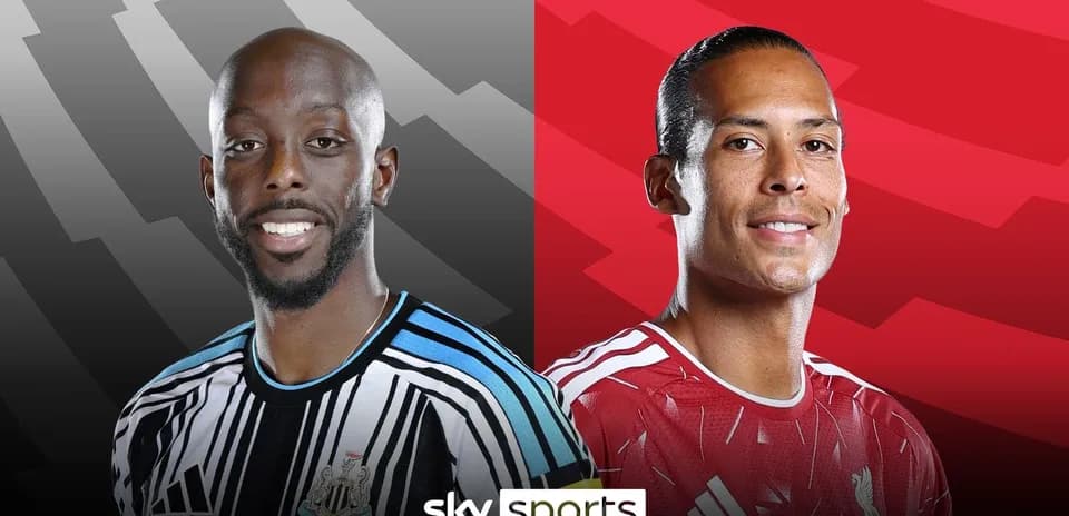 Two football players from Newcastle and Liverpool smiling