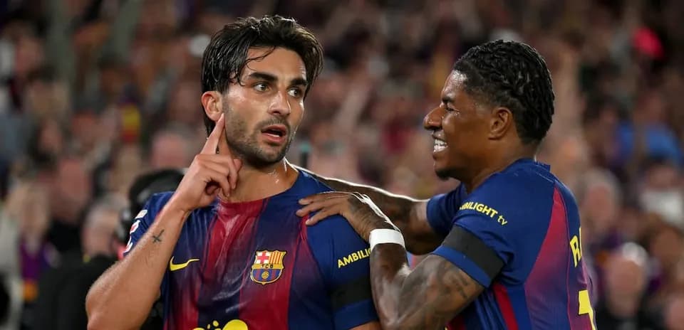 Barcelona players celebrating a goal on the pitch