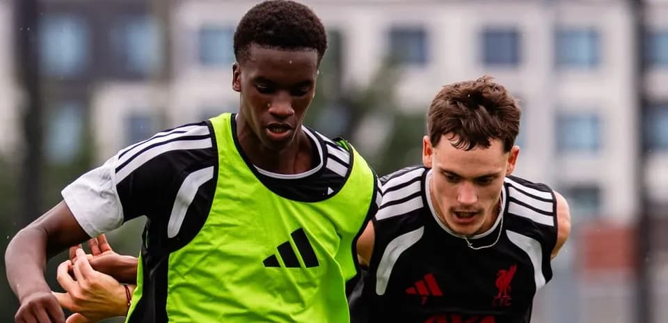 Two players competing for the ball during training