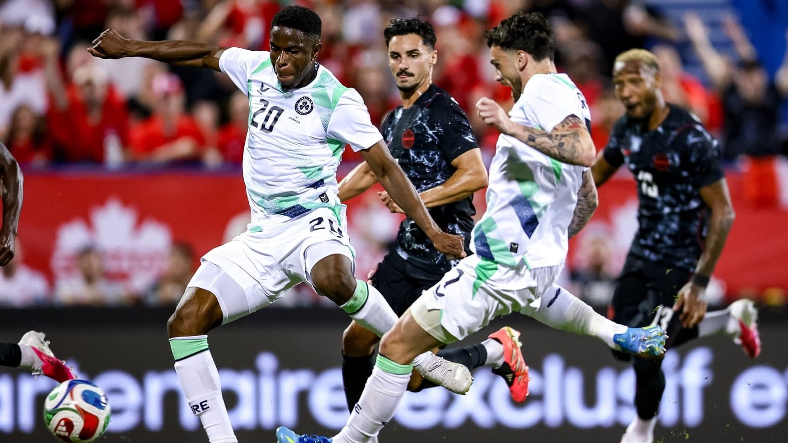Players competing for the ball during a soccer match