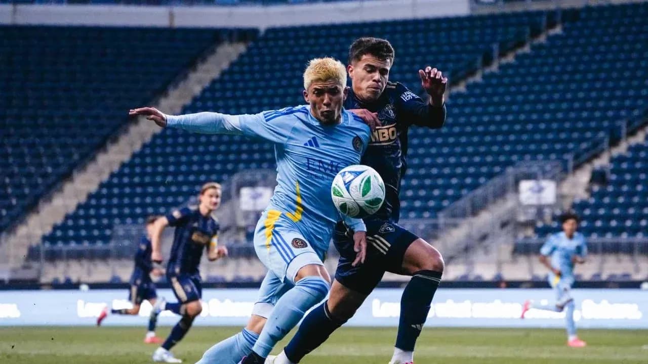 Players competing for the ball during match