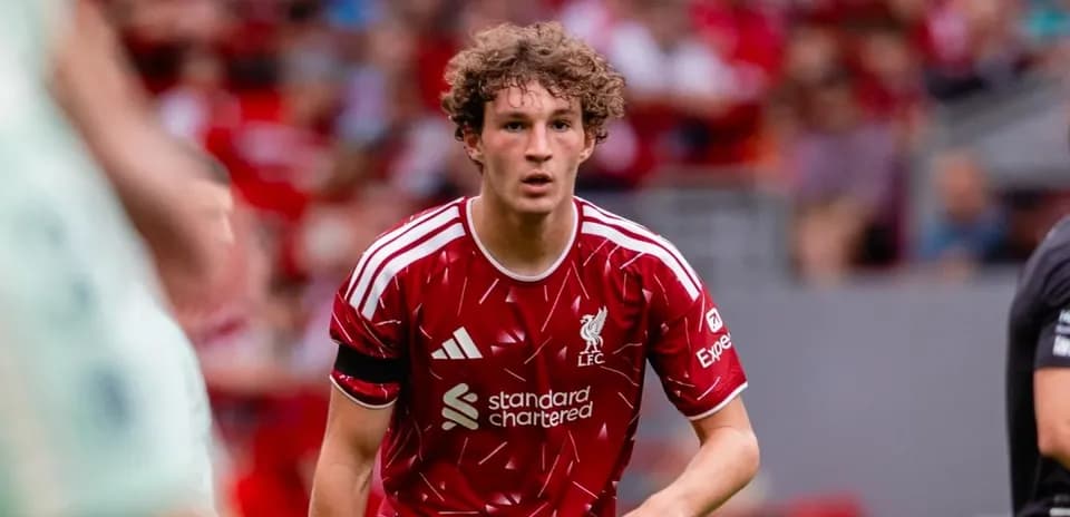 Player in red Liverpool kit on the pitch