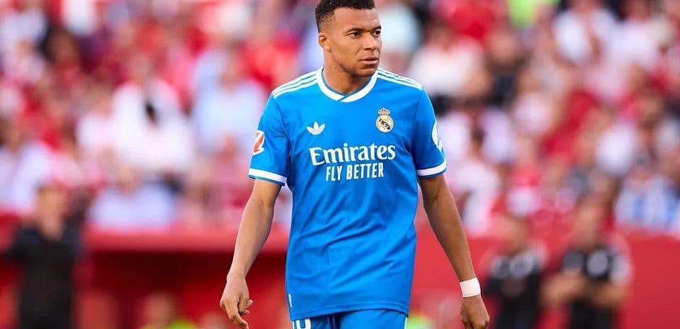 Player in blue Real Madrid kit on the field