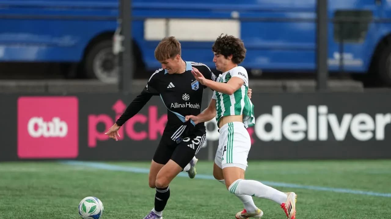 Players battling for the ball during match