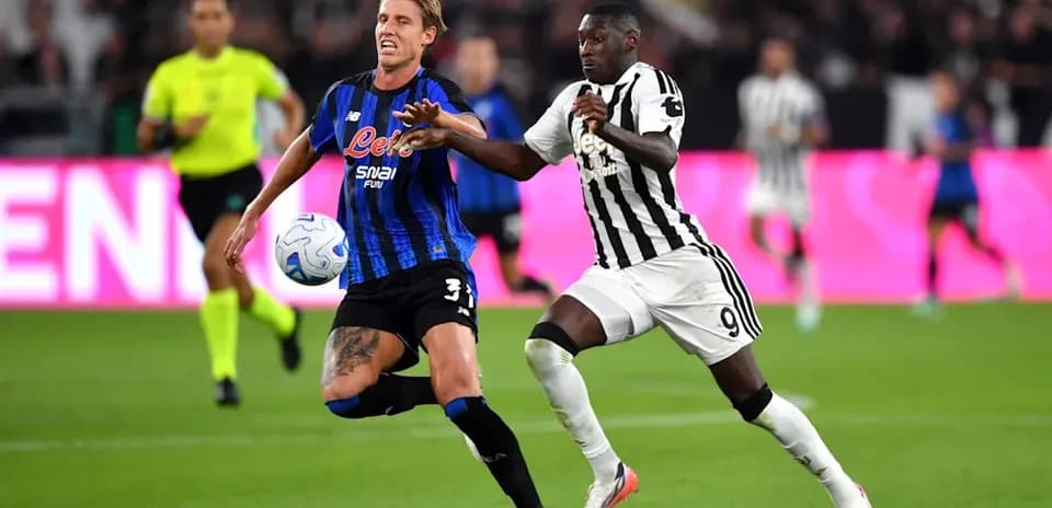 Two players contesting for the ball during match