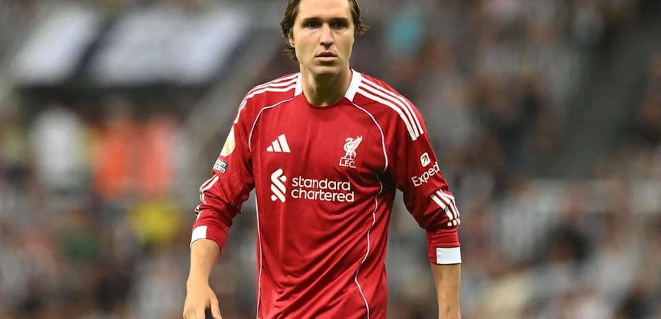 Player wearing Liverpool jersey on the pitch