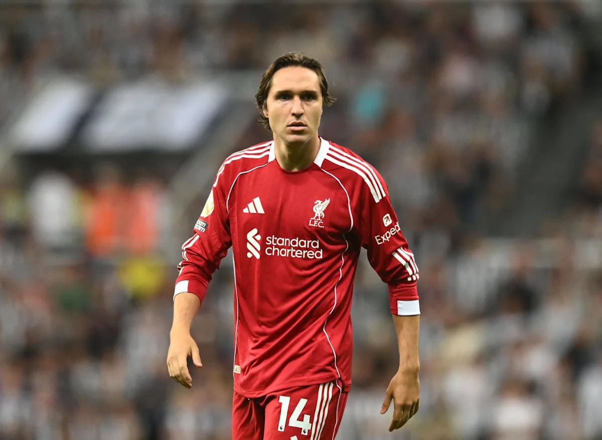 Player wearing Liverpool jersey on the pitch