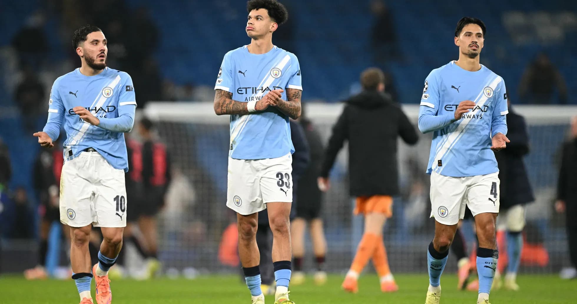 Manchester City players walking off the pitch after match