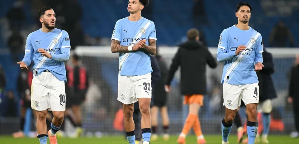 Manchester City players walking off the pitch after match