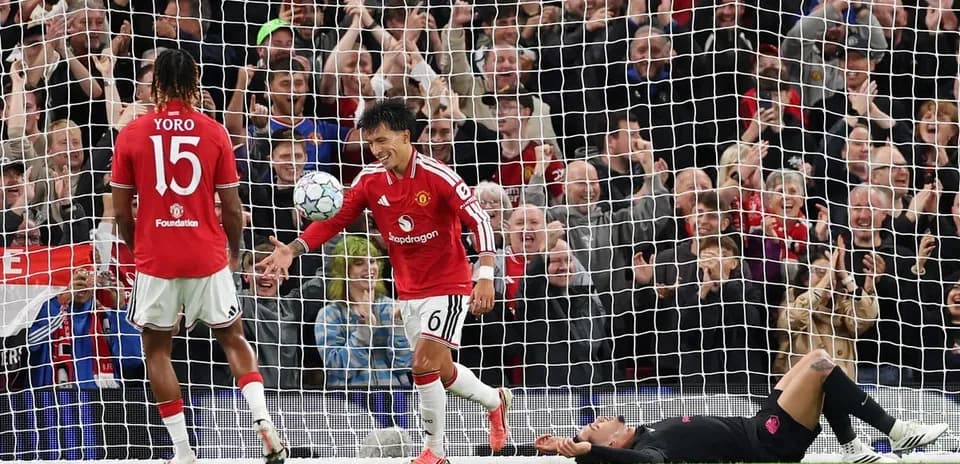 Manchester United players celebrating after scoring a goal