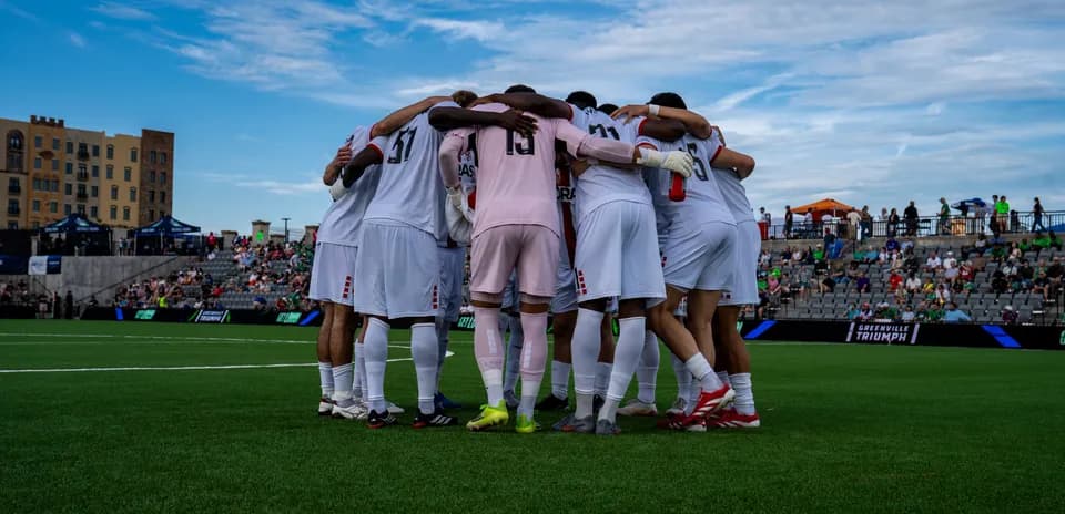Greenville Triumph players in pre-match huddle