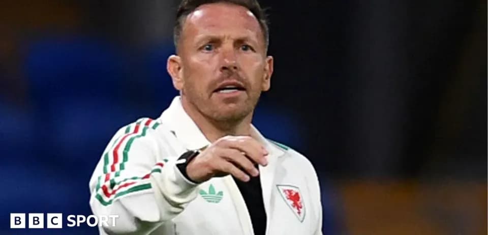 Wales football coach giving instructions on field