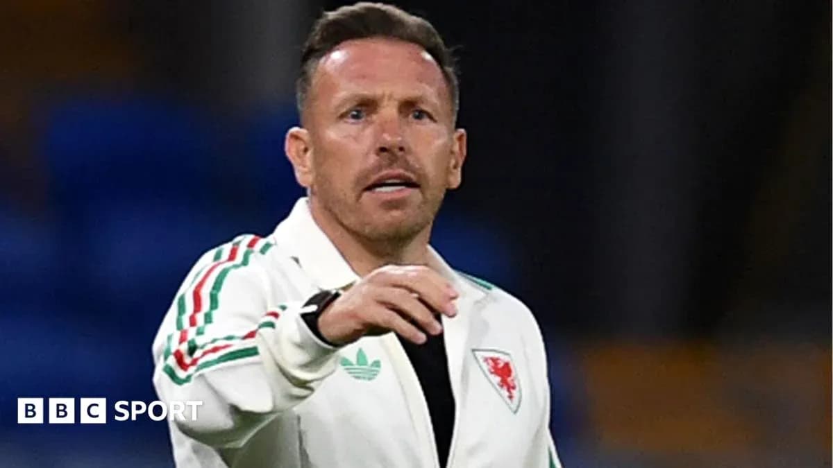 Wales football coach giving instructions on field