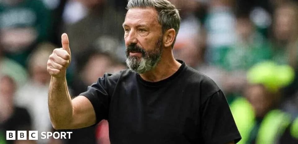 Coach giving thumbs up during match