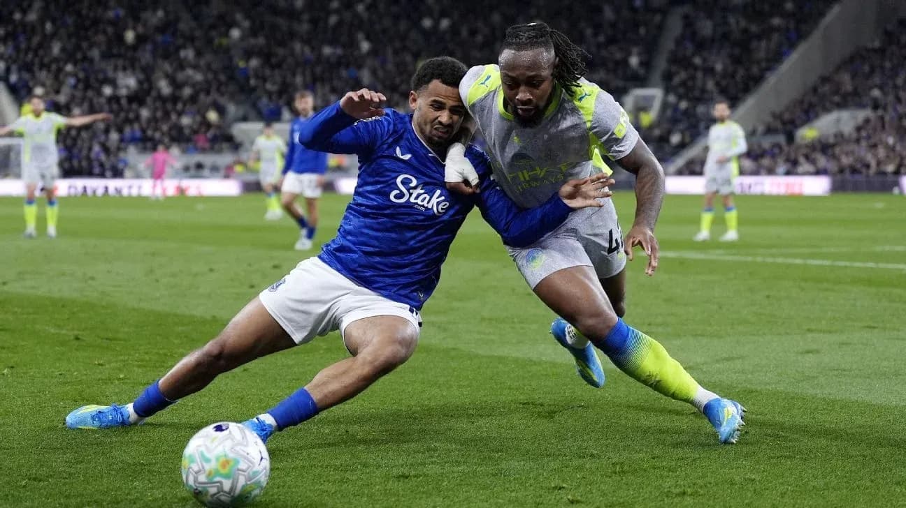 Two players battling for possession on the field