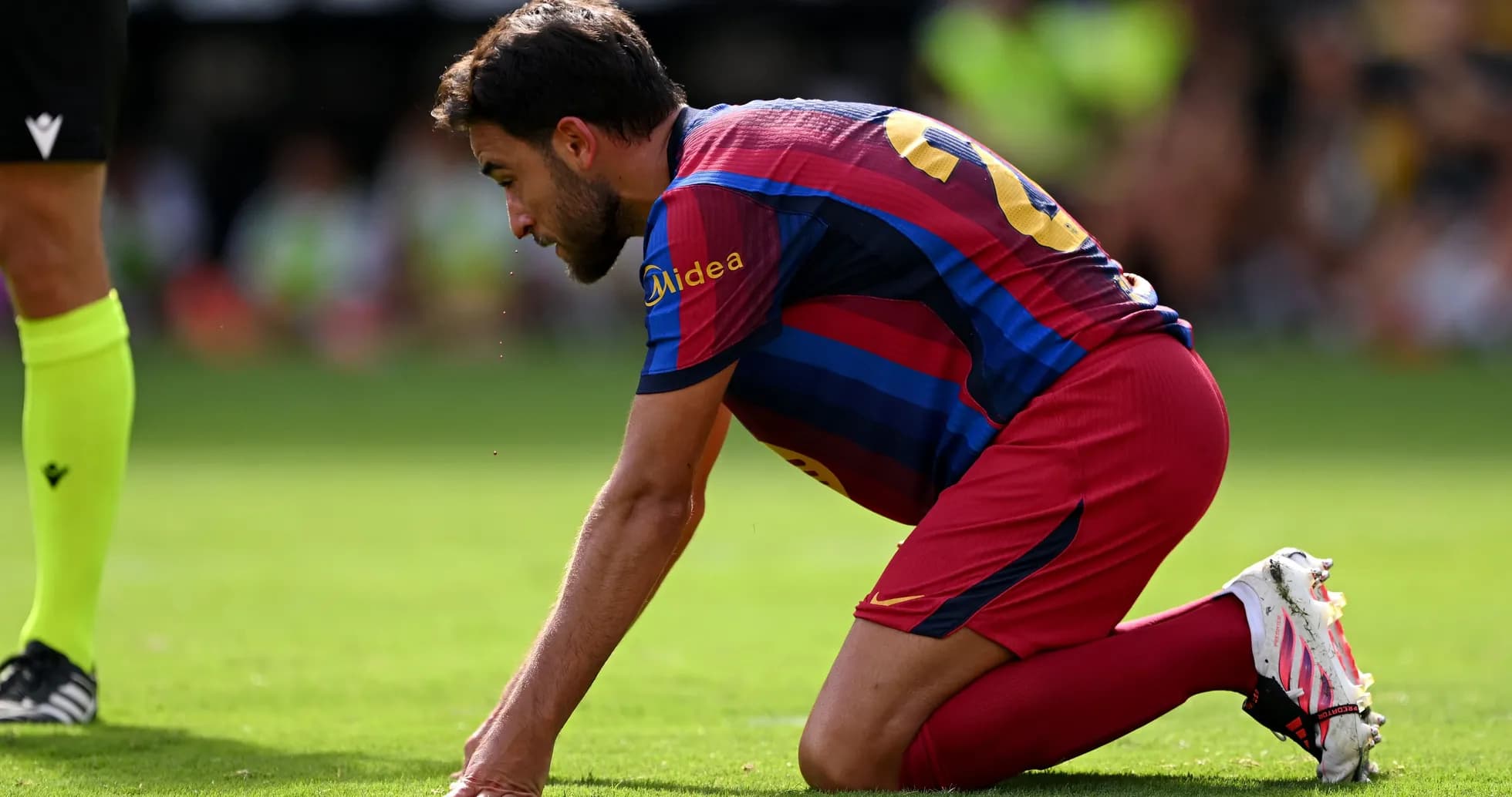 Player kneeling on field during match action
