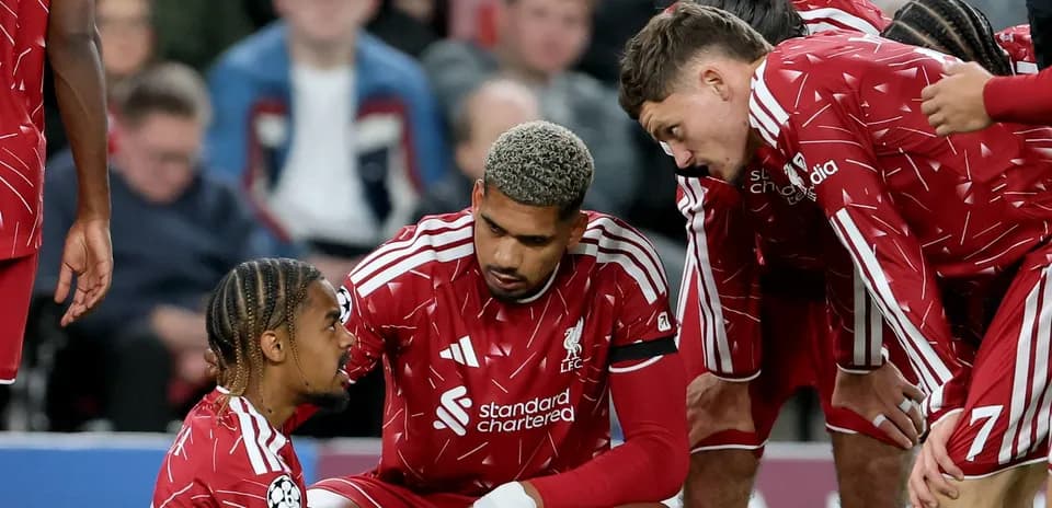 Liverpool players discussing during a match break