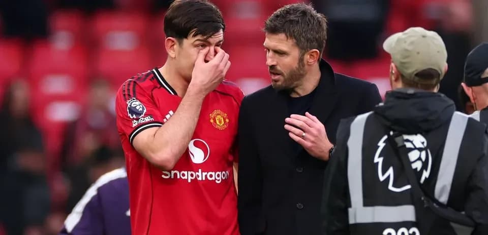 Player speaking with coach after match at stadium