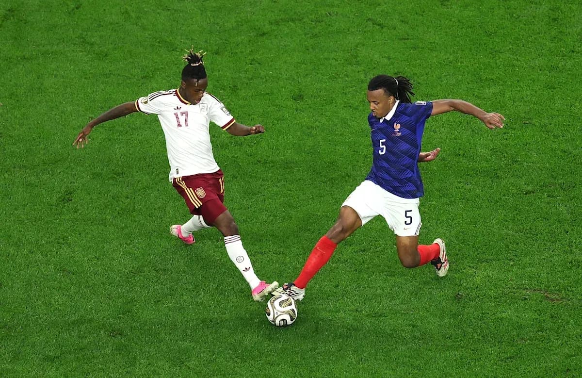 Two players challenging for the ball during match