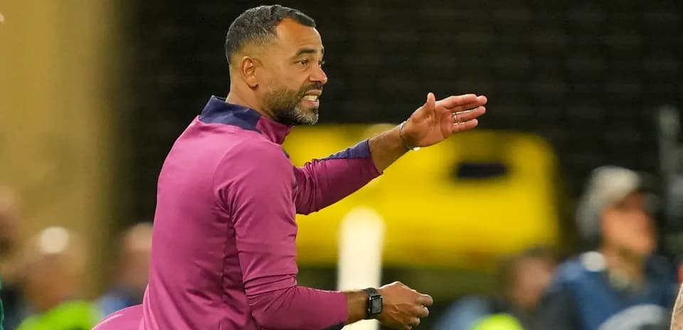 Coach gesturing during a football match