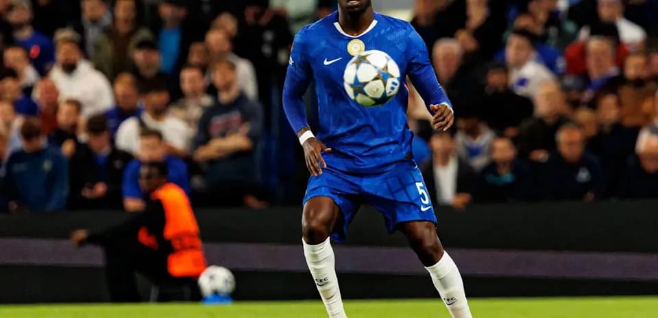 Player in blue jersey controlling the soccer ball