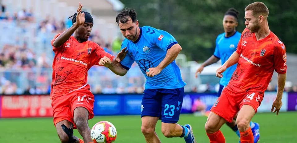 Players competing for the ball during match
