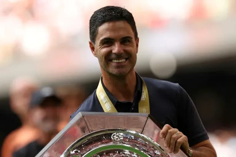 Coach holding trophy during celebration ceremony