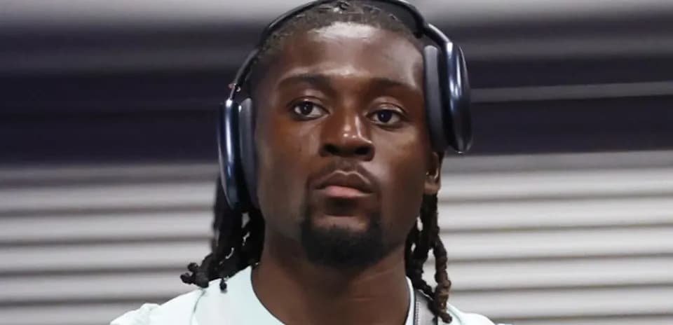Player wearing headphones in indoor setting