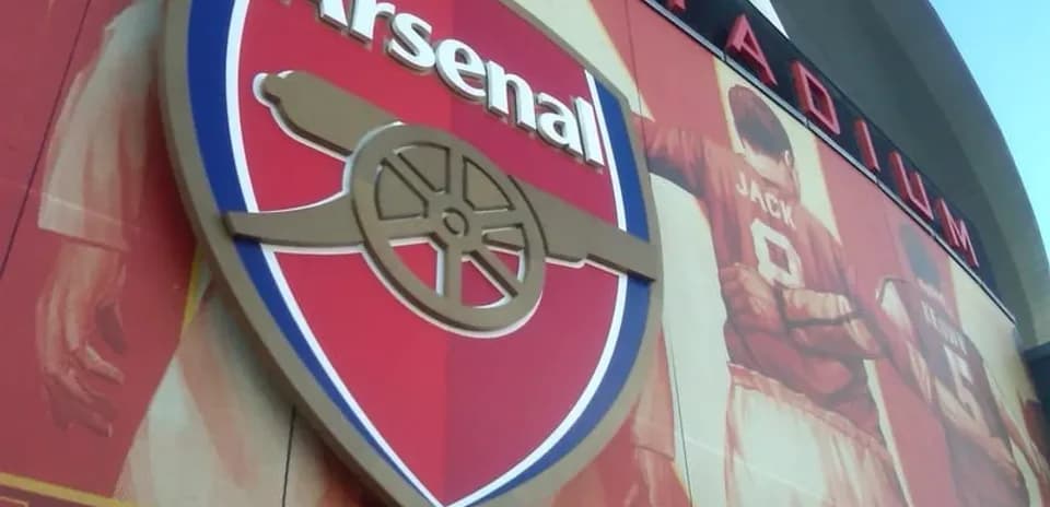 Arsenal FC logo displayed on stadium wall