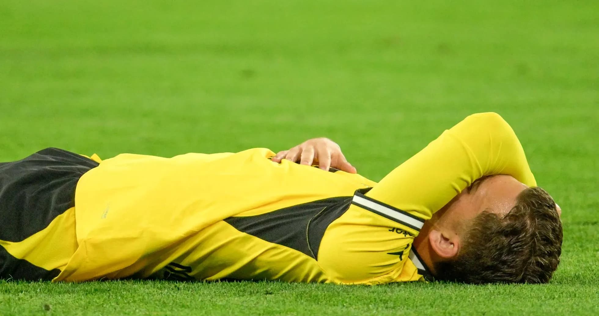 Player lying on the ground during a match