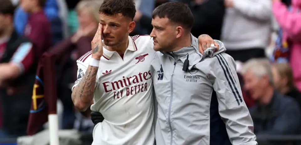 Player receiving support from teammate after match