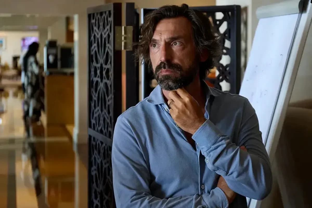 Man in blue shirt standing near a partition