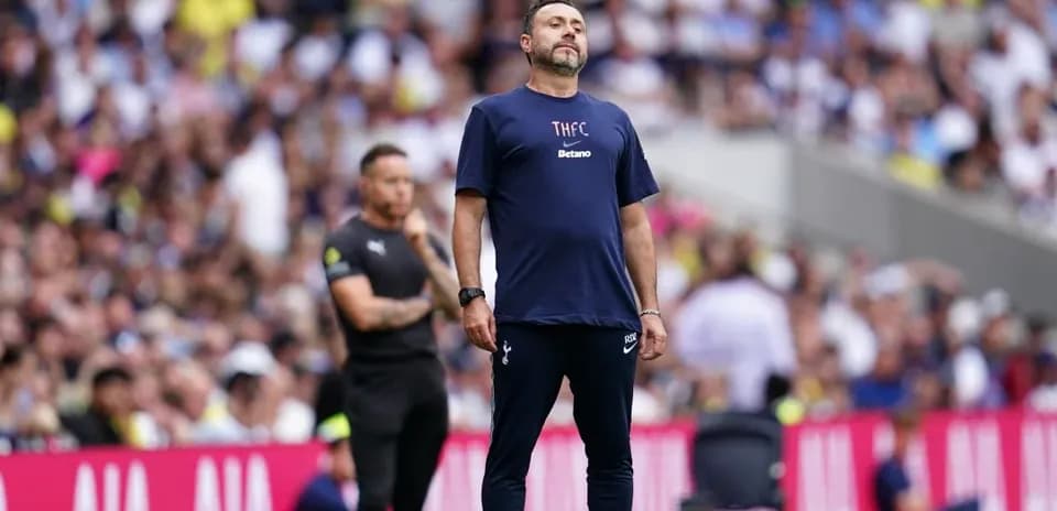 Coach observing the match from the sidelines