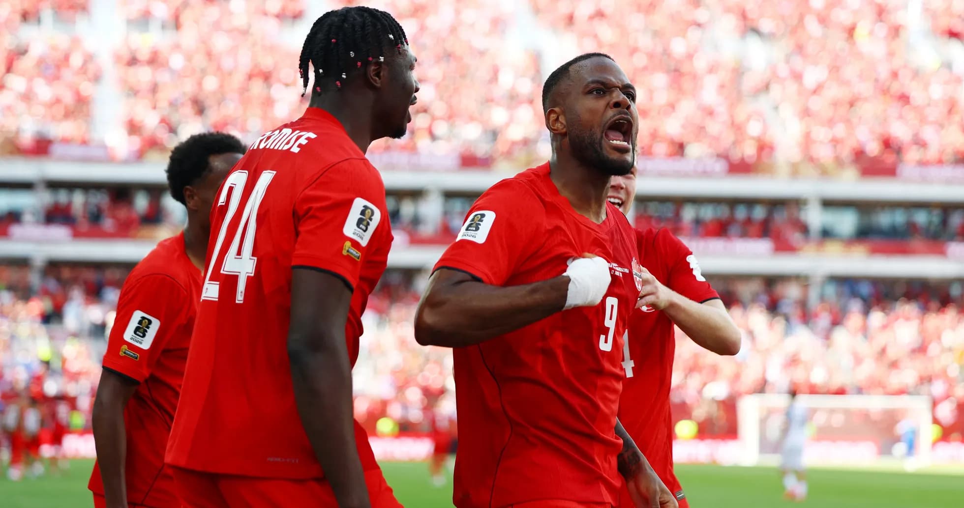 Canada players celebrating a goal during match