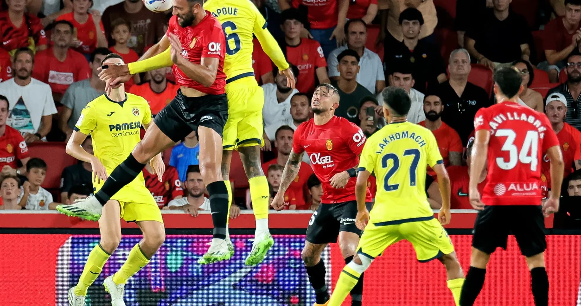Players contesting for the ball in La Liga match