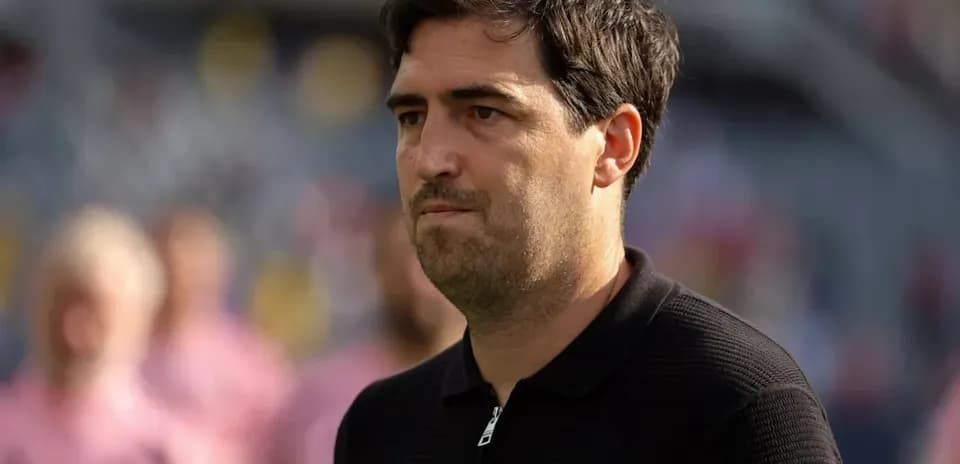 Coach observing match before kickoff on the field