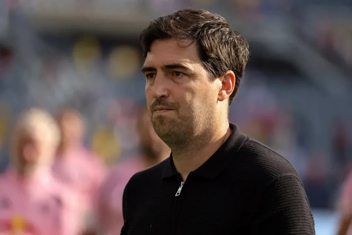 Coach observing match before kickoff on the field