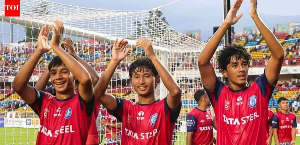 Three players celebrating after a match in stadium