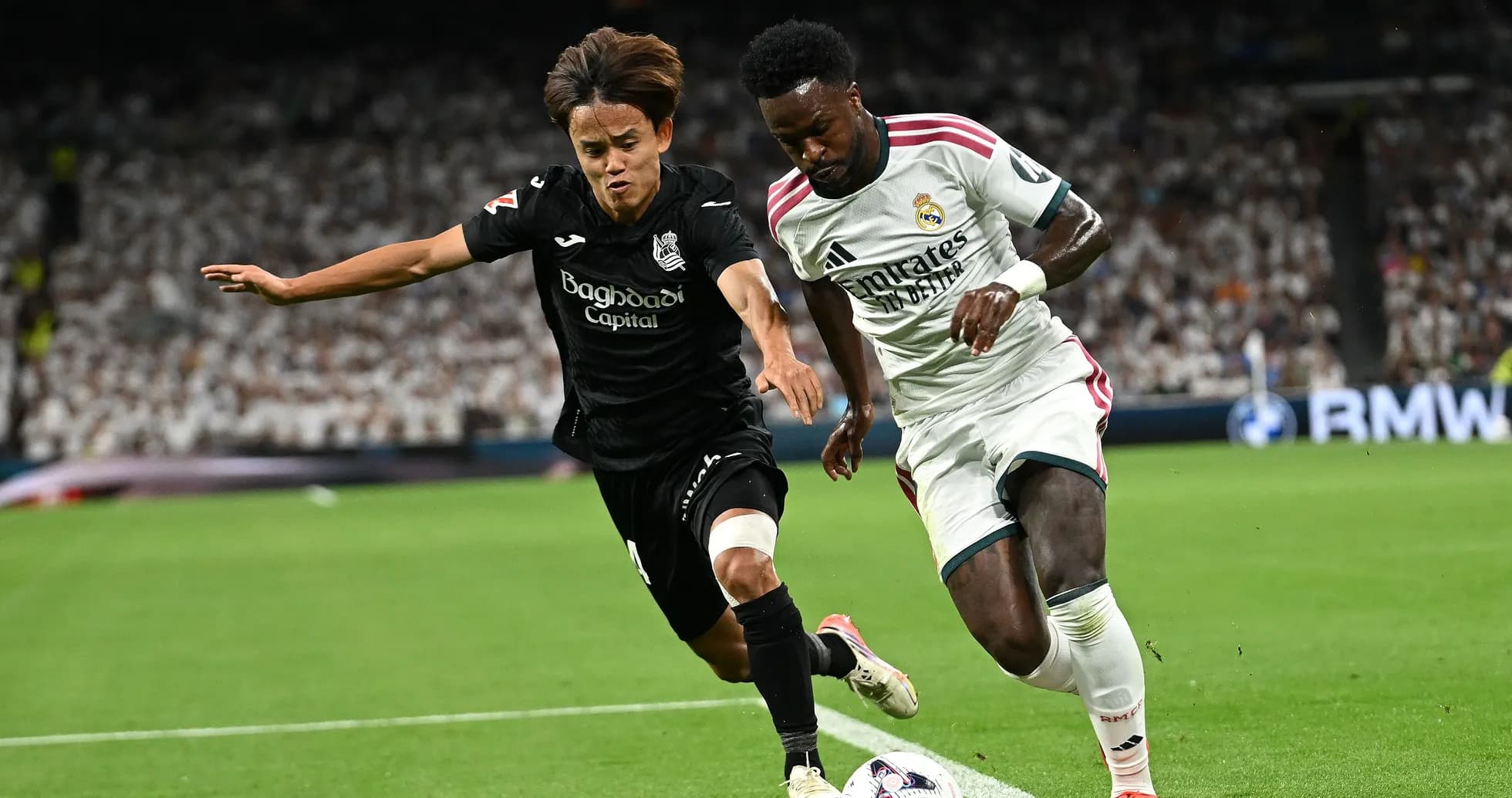 Two players battling for the ball during match
