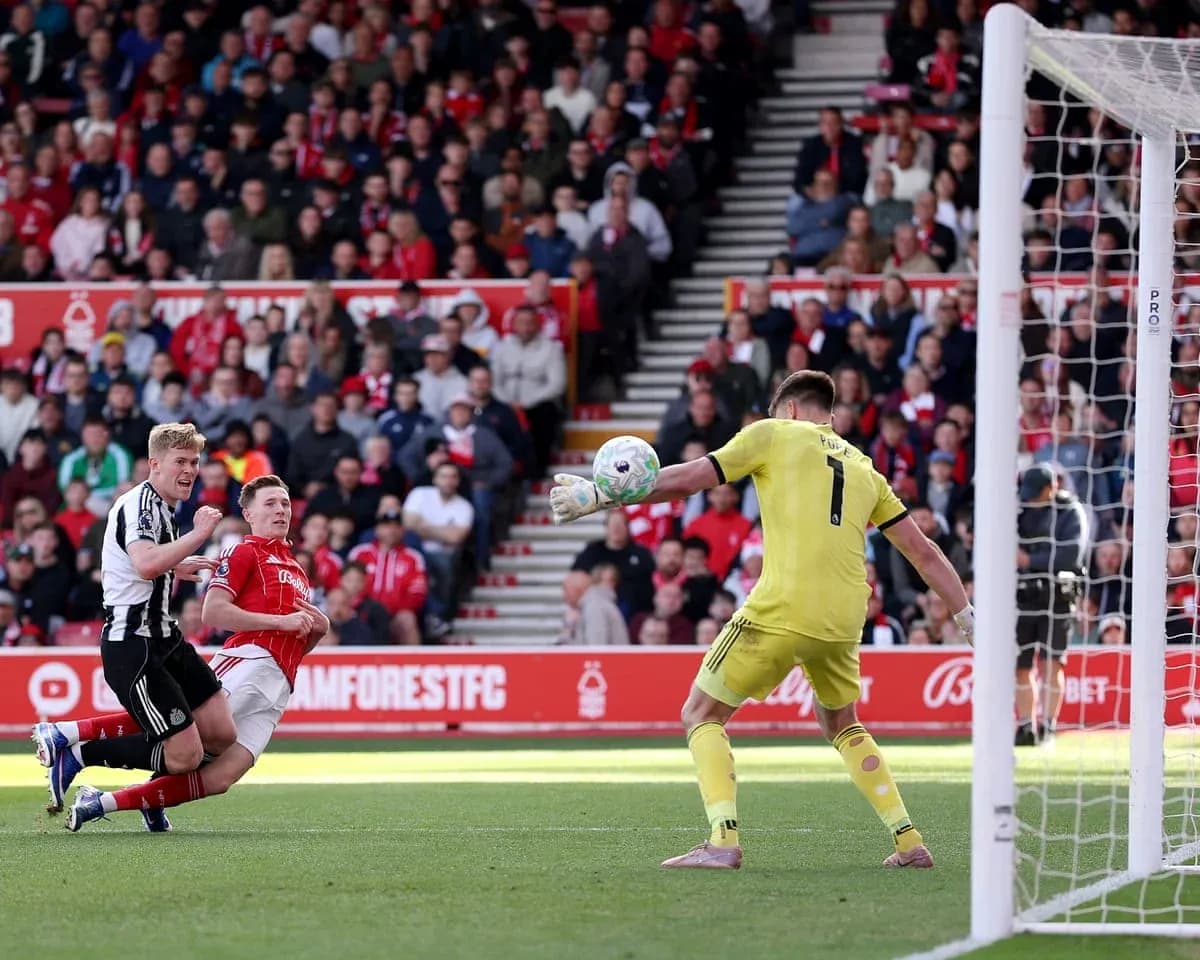 Goalkeeper saving a shot during Nottingham Forest match