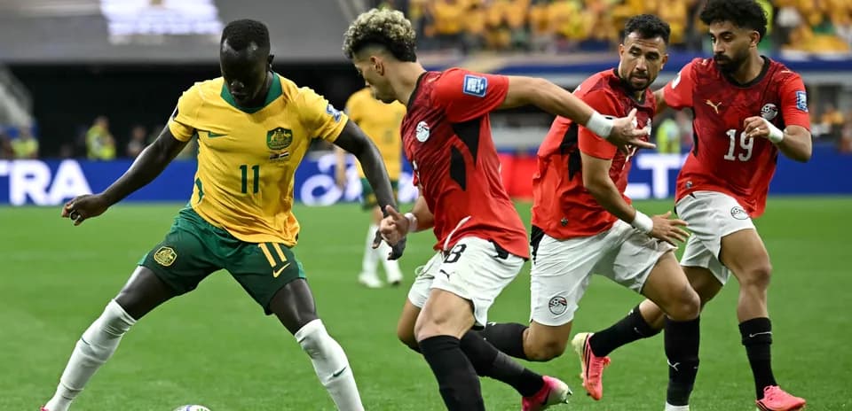Players from Australia and Egypt competing for the ball