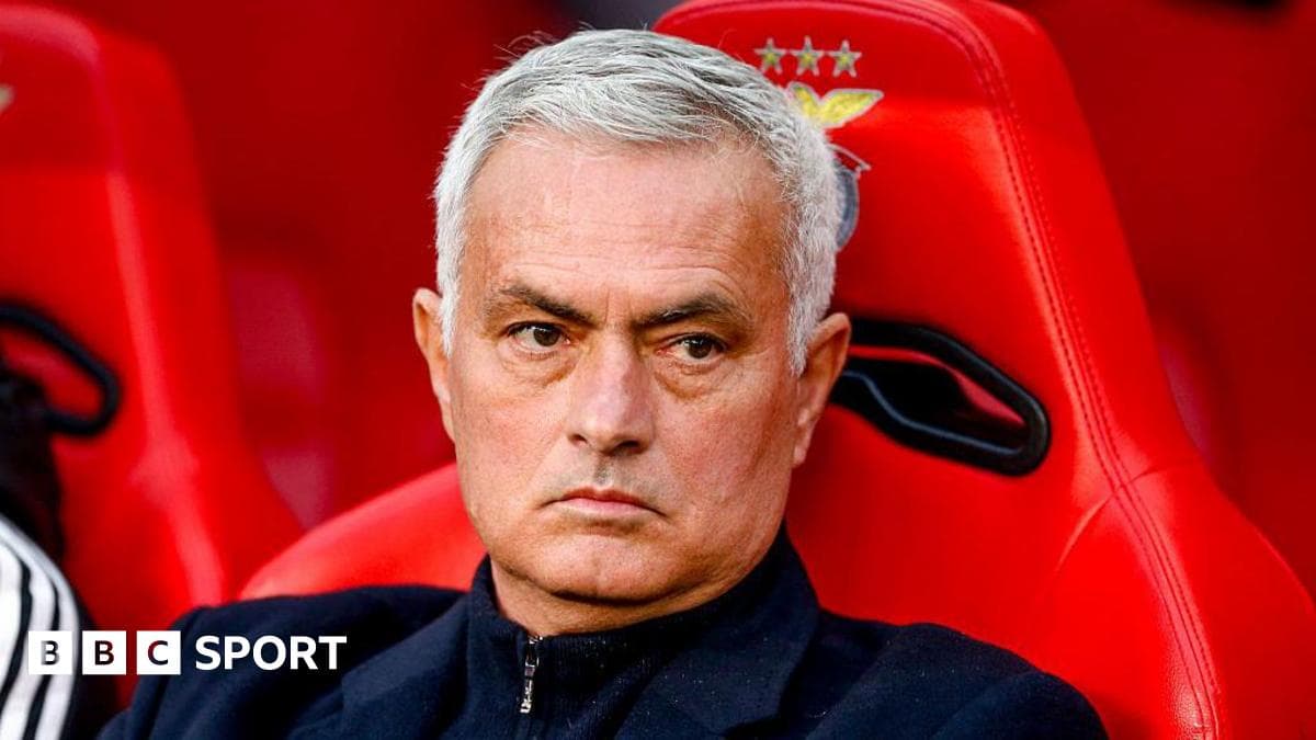 Manager sitting on bench during match